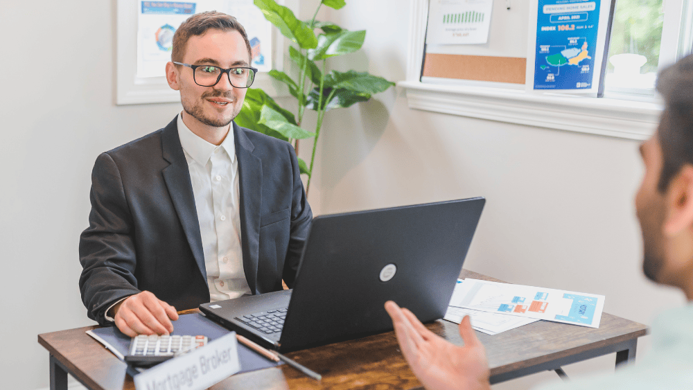 Broker discussing loan types with customer