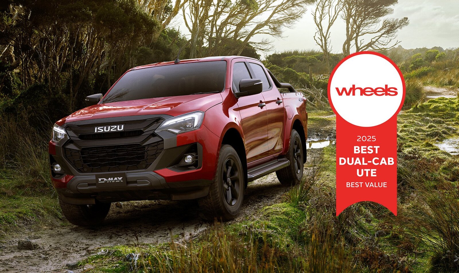 Isuzu D-Max driving on remote road with award badge