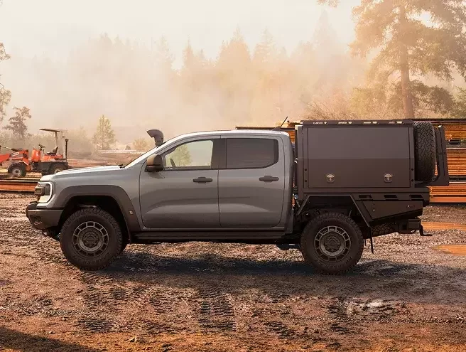 Isuzu D-Max driving on remote road with award badge